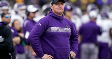 FILE - Northwestern head coach Pat Fitzgerald stands on the sideline during the first half of an NCAA college football game against Michigan, Oct. 23, 2021, in Ann Arbor, Mich. (AP Photo/Carlos Osorio, File)
