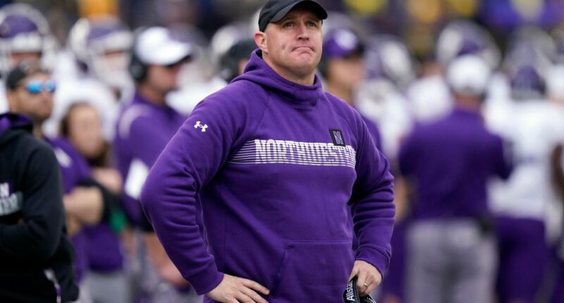 FILE - Northwestern head coach Pat Fitzgerald stands on the sideline during the first half of an NCAA college football game against Michigan, Oct. 23, 2021, in Ann Arbor, Mich. (AP Photo/Carlos Osorio, File)