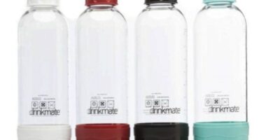 Four Drinkmate 1-liter carbonation bottles in white, red, black, and teal.
