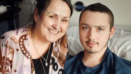 Brandan with his mum during cancer treatment.