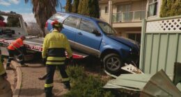 It's understood the driver may have been unconscious behind the wheel as the blue SUV was seen mounting a roundabout before disappearing through a park and towards houses.