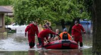 Over 900 flights delayed and 14 million remain under flood alerts