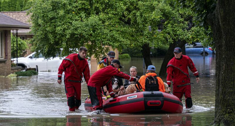 Over 900 flights delayed and 14 million remain under flood alerts