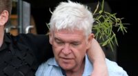Phillip Schofield is worse-for-wear while supported by handsome male