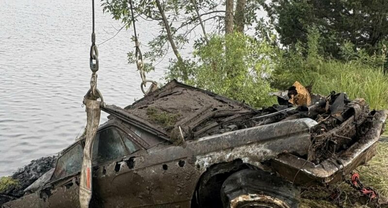 Photo of Buick being dragged from river could solve chilling mystery