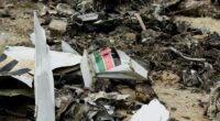 Debris from a plane crash on the ground.