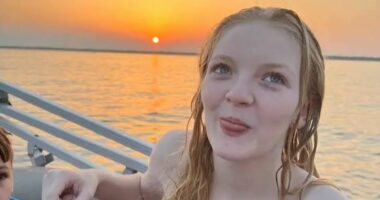 Photo of Katelynn, a pregnant 17-year-old girl, on a boat at sunset.