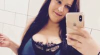 Selfie of a woman in a blue dress.