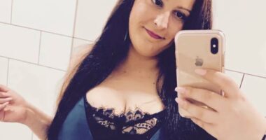 Selfie of a woman in a blue dress.