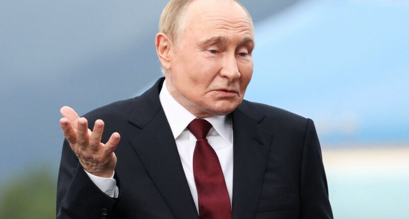 Vladimir Putin reacting.