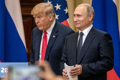HELSINKI, FINLAND - JULY 16:  U.S. President Donald Trump (L) and Russian President Vladimir Putin arrive to waiting media during a joint press conference after their summit on July 16, 2018 in Helsinki, Finland. The two leaders met one-on-one and discussed a range of issues including the 2016 U.S Election collusion.  (Photo by Chris McGrath/Getty Images) *** Local Caption *** Donald Trump: Vladimir Putin