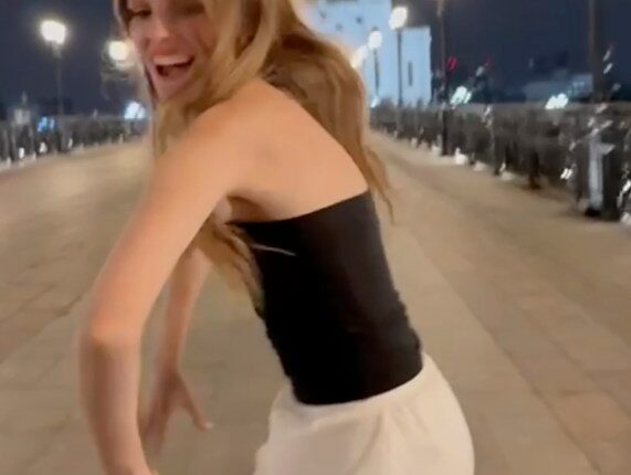 Student twerking in front of a Moscow cathedral.