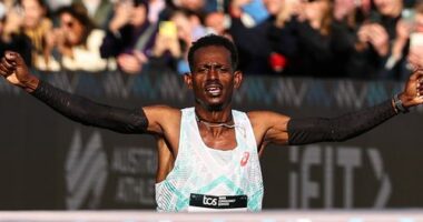 SYDNEY, AUSTRALIA - AUGUST 31: Hailemaryam Kiros Kebedew celebrates winning the Mens Marathon during the 2025 Sydney Marathon on August 31, 2025 in Sydney, Australia. (Photo by Jeremy Ng/Getty Images for Adidas)