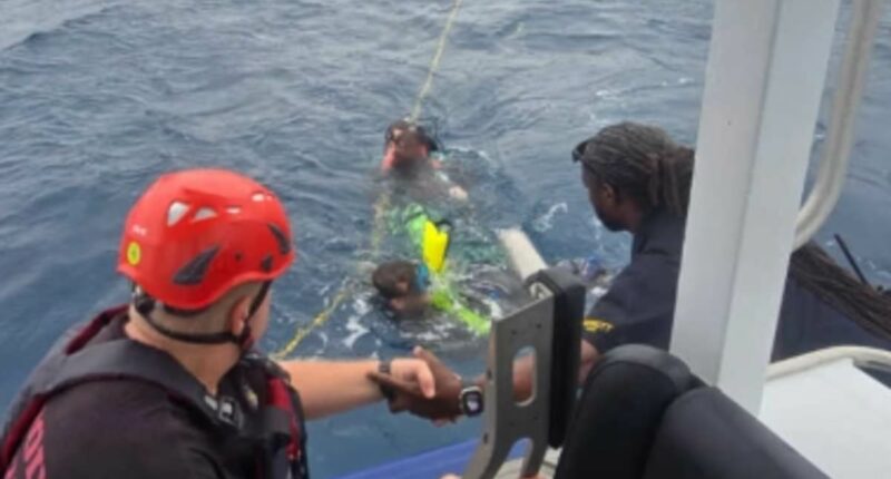 Rescue crews scramble to save divers swept away by Hurricane Erin