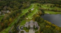 Aerial view of a golf course with clubhouse.