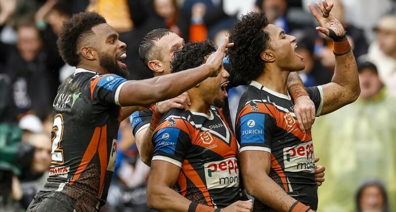 See the photo that shows the OTHER side of the scandal over NRL stars giving fans the 'Arab middle finger' as club's supporters are branded hypocrites
