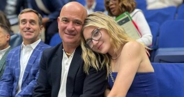 Super-secretive Andre Agassi and Steffi Graf's rarely-seen daughter, 21, makes surprise appearance alongside 'superhero' father at US Open - as she shares snap with mystery man