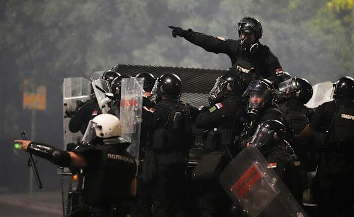 Tensions soar in Serbia as angry protesters clash with police, set fire to party offices