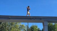 Terrifying moment lone child nearly falls off rail at Hersheypark