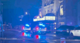 Tour guides aid gunshot victim in front of Lucas Theater
