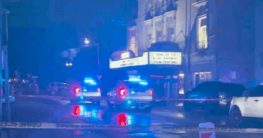Tour guides aid gunshot victim in front of Lucas Theater