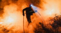 Tourists run during 'Satan's Storm' in Spain as country battles fires