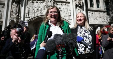 Two women giving a press conference outside the Supreme Court.