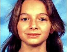 Photo of a young girl with shoulder-length brown hair.