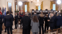 Trump speaking to someone in the Oval Office.
