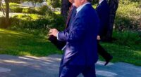 Steve Witkoff and Kirill Dmitriev walking in a park.