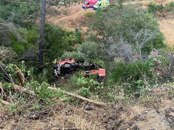 Firetruck accident scene with two fatalities and three serious injuries.