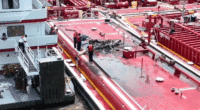 Two people killed after helicopter hits power line and crashes into barge on Mississippi River