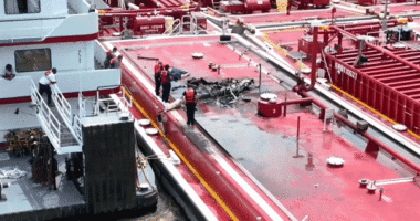 Two people killed after helicopter hits power line and crashes into barge on Mississippi River