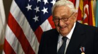Henry Kissinger receiving an award.