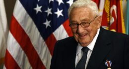 Henry Kissinger receiving an award.