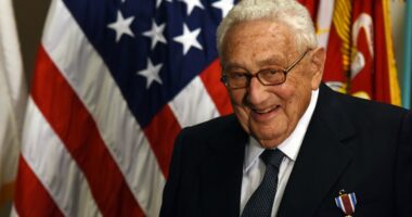 Henry Kissinger receiving an award.