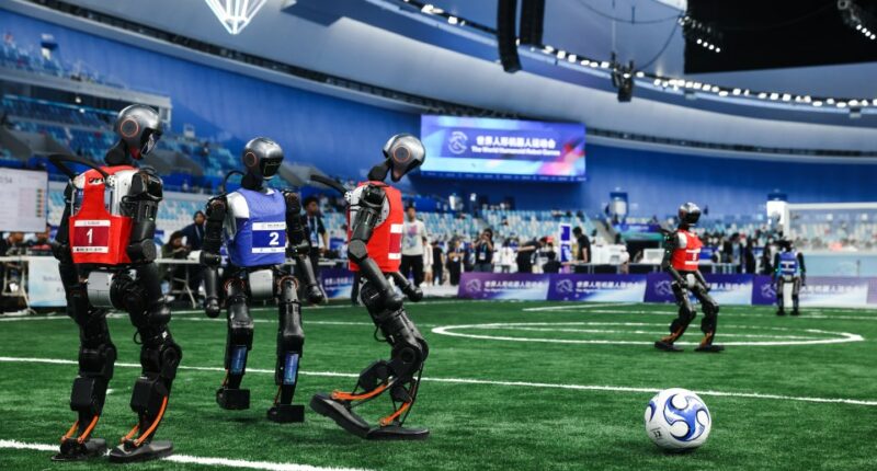 Humanoid robots playing soccer at the World Humanoid Robot Games.