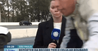 Reporter having phone stolen on live TV.