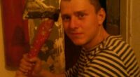 Ruslan Shingirey holding an axe.