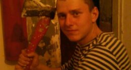 Ruslan Shingirey holding an axe.