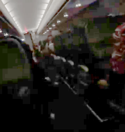 Terrified airplane passengers during turbulence.