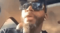 Man in car speaking.