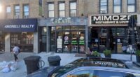 Street-level view of Create Fresh Vibrant Foods, Amorelli Realty, and Mimosa Restaurant & Lounge in Astoria, NYC.