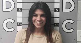 Woman's smiling mugshot goes viral after alleged $12K car vandalism spree against ex-boyfriend