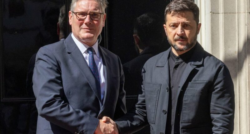 Volodymyr Zelensky and Keir Starmer shaking hands outside 10 Downing Street.