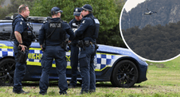 Manhunt for 'heavily armed' accused cop killer into second day