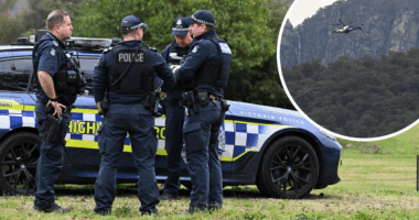 Manhunt for 'heavily armed' accused cop killer into second day