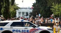 Police car is parked near protestors in DC