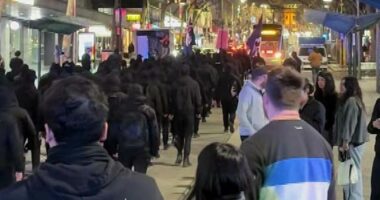 Neo-Nazis march through Melbourne in early hours of the morning