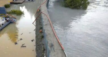 New river barriers prevented severe flood damage from a glacial outburst in Alaska, officials say